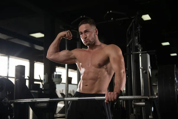 Healthy Young Man Flexing Muscles — Stock Photo, Image