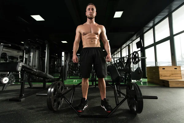 Young Bodybuilder Flexing Muscles