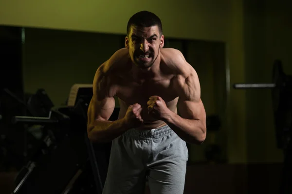 Healthy Young Man Flexing Muscles — Stock Photo, Image