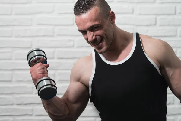 Young Man Exercise Biceps With Dumbbells — Stock Photo, Image