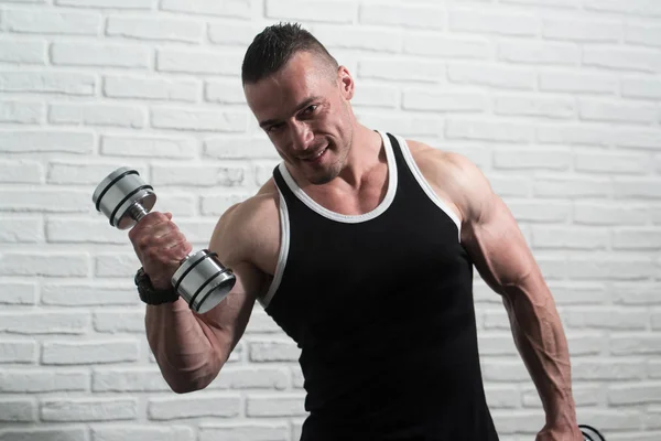 Young Man Exercise Biceps With Dumbbells — Stock Photo, Image