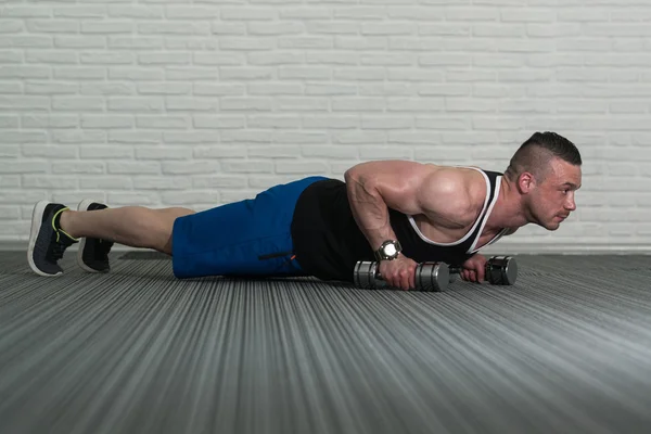 Push Ups with Dumbells — стоковое фото