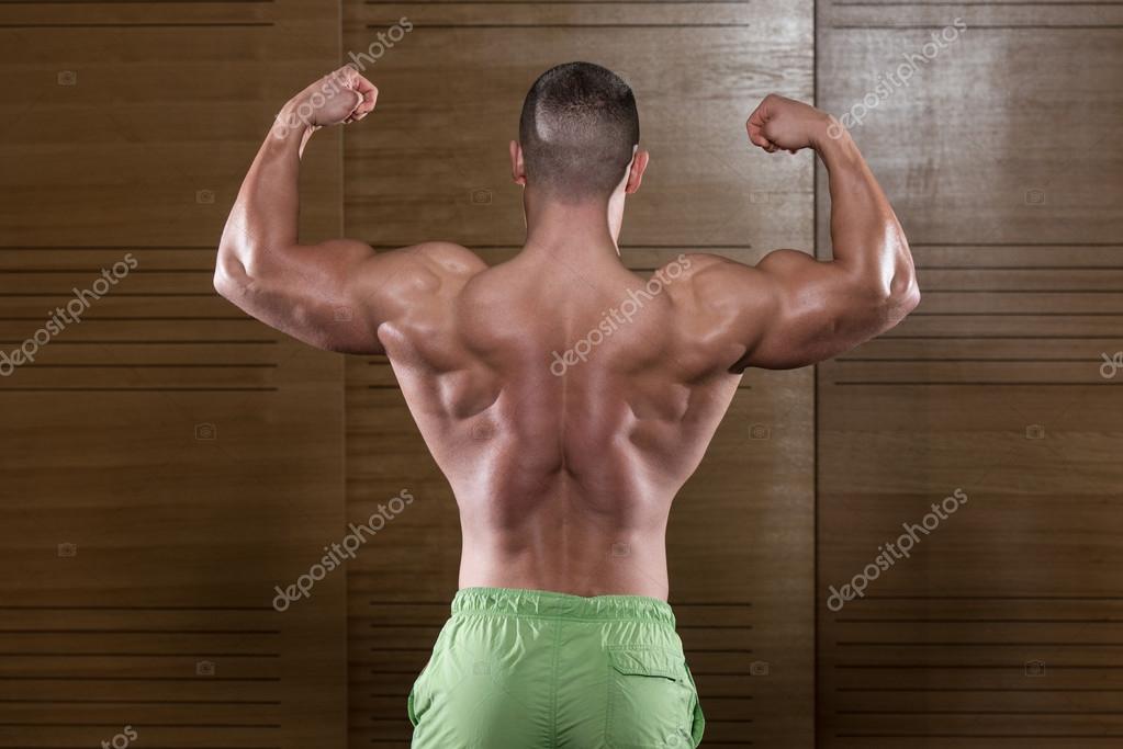 Premium Photo | Back pose of a muscular man