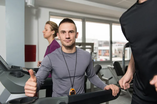 Personal Trainer Showing Ok Sign To Client