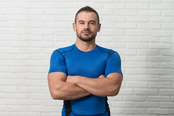 Portrait Of Personal Trainer On White Bricks Background — Stock Photo, Image