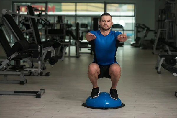 Personal Trainer Doing Exercise On Bosu Balance Ball — Stock Photo, Image