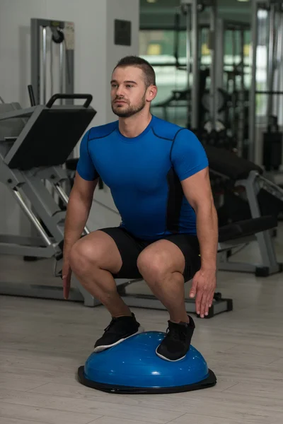 Personal Trainer Doing Exercise On Bosu Balance Ball — Stock Photo, Image