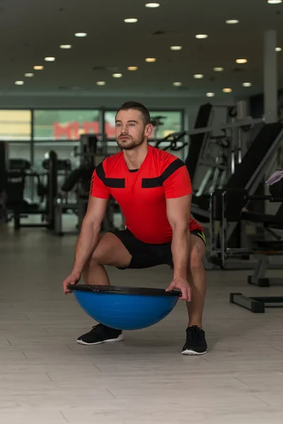 Personal Trainer Doing Exercise On Bosu Balance Ball — Stock Photo, Image