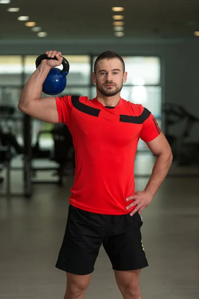 Personal Trainer Exercising With Kettle-bell — Stock Photo, Image