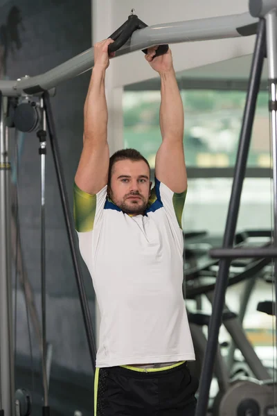 Man Training Back Exercises On A Machine — Stock Photo, Image