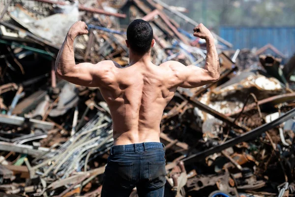 Handsome Man Standing Strong Scrap Metal Industrial Junkyard Flexing Muscles — Stock Photo, Image