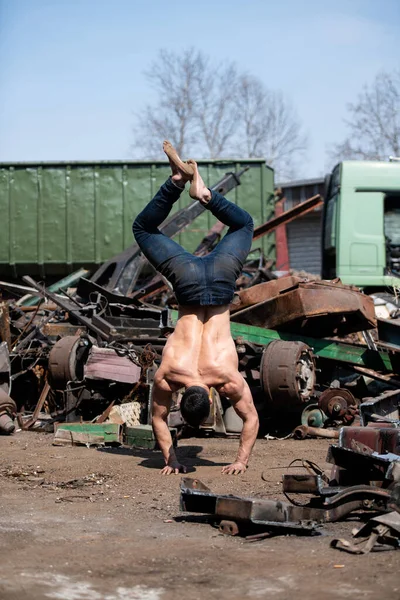 Handsome Man Keeping Balance Hands Old Industrial Junk Yard Muscular — 스톡 사진