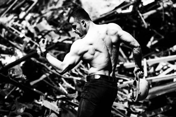 Handsome Man Standing Strong Scrap Metal Industrial Junkyard Flexing Muscles — Stock fotografie