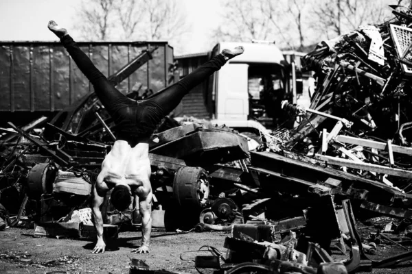 Handsome Man Keeping Balance Hand Old Industrial Junk Yard Muscular — Stock Photo, Image