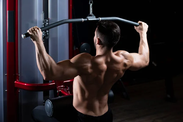 Handsome Athlete Doing Heavy Weight Exercise Back Machine — Stock Photo, Image