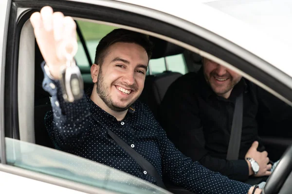 Portrait Young Man Showing Car Key While Sitting Car — Stock Photo, Image