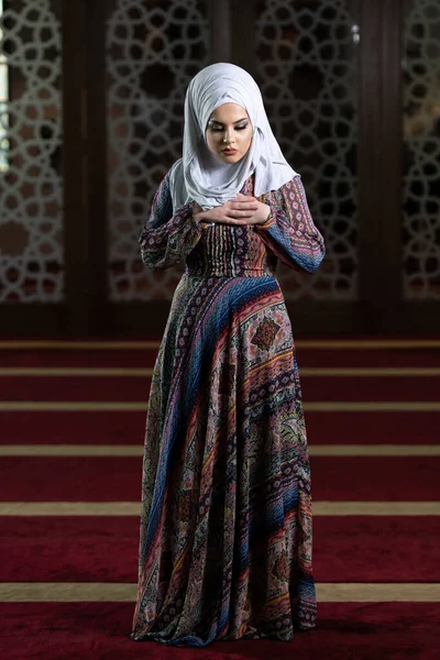 Humble Muslim Woman Is Praying in the Mosque