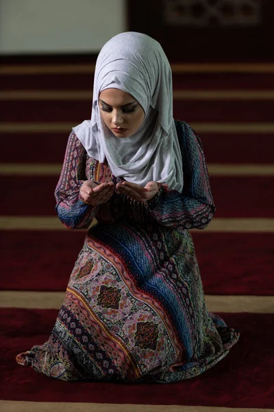 Humble Muslim Woman Is Praying in the Mosque