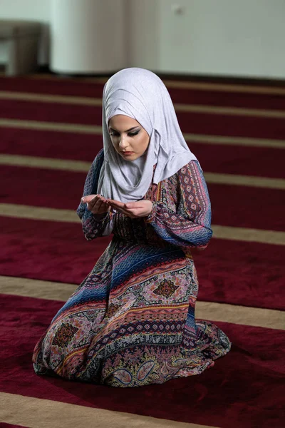 Humble Muslim Woman Is Praying in the Mosque