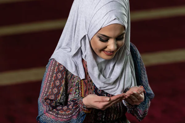 Young Muslim Woman Is Praying in the Mosque