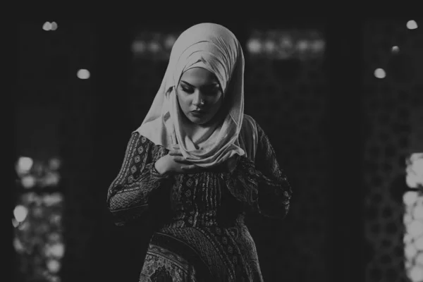 Young Muslim Woman Is Praying in the Mosque