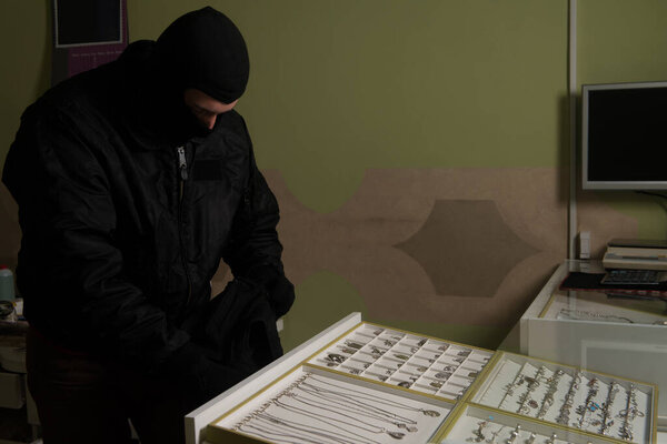 Man Wearing a Mask Robbed a Jewelry Store - Robbery Concep