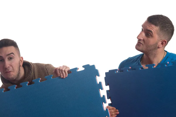 Young Men Holding Blue Tatami Mat Puzzle Isolated White Background — Stock Photo, Image