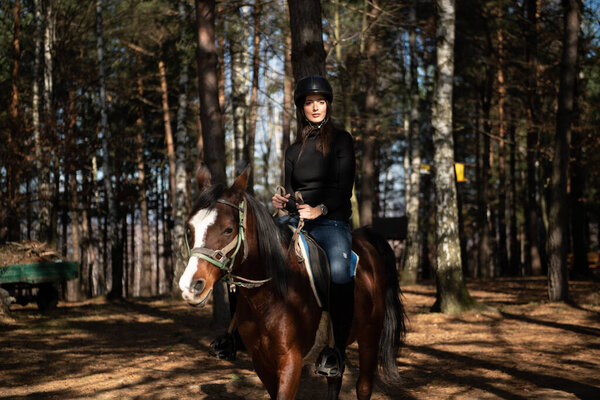 Young Woman Rider With Her Horse Enjoying Good Mood in Evening Sunset Light