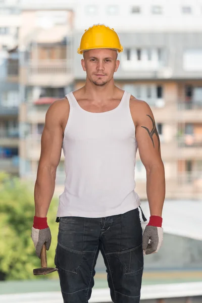 Construction Man Working With Hammer — Zdjęcie stockowe