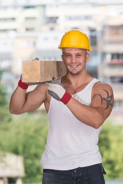 Handsome Man Carrying Wood Planks — Stock Photo, Image