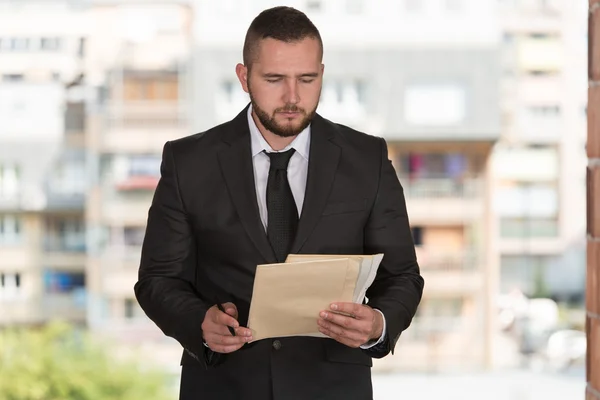 Caucasian Male Construction Manager With Blueprint — Stock Photo, Image