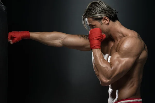 MMA Fighter Practicing With Boxing Bag — Stock Photo, Image