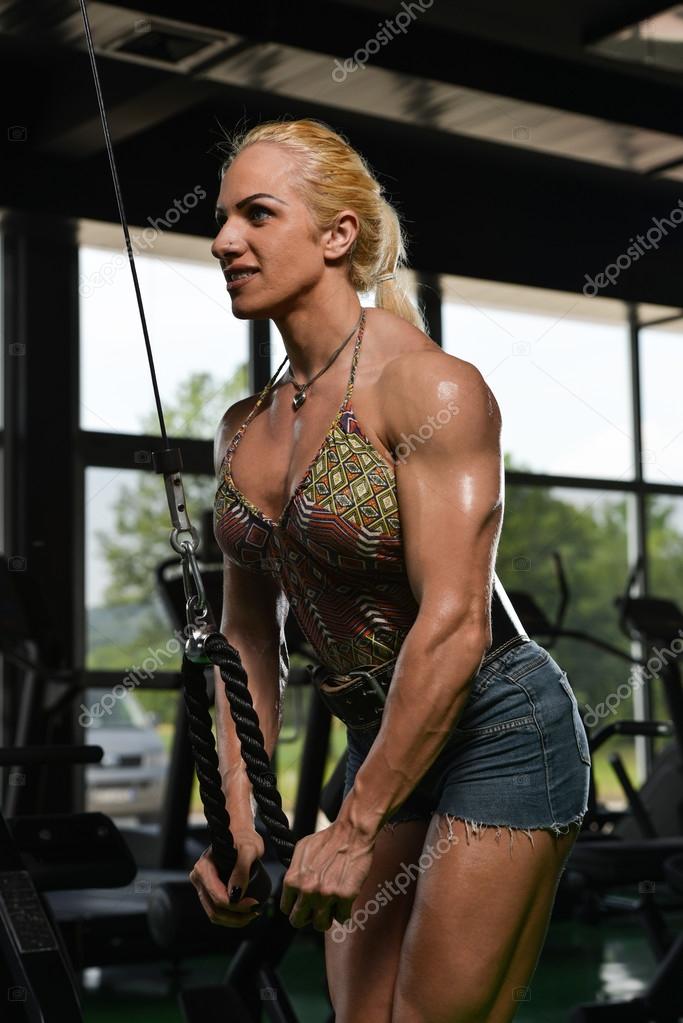 Female Bodybuilder Doing Heavy Weight Exercise For Triceps Stock Photo by  ©ibrak 53216847