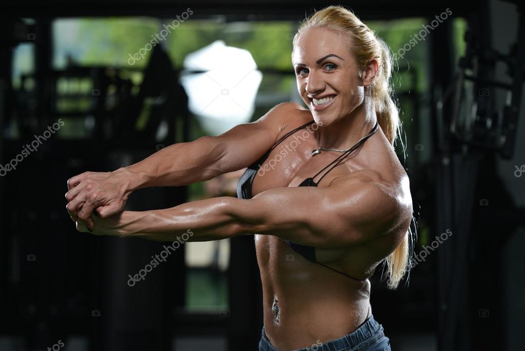 Female bodybuilder flexing muscles in hi-res stock photography and images -  Alamy