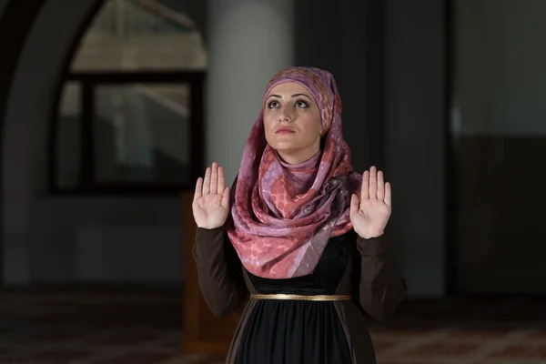 Muslim Woman Praying In Mosque