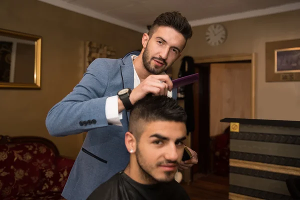 Male Hairdresser Cutting Hair Of Smiling Man Client — Stock Photo, Image