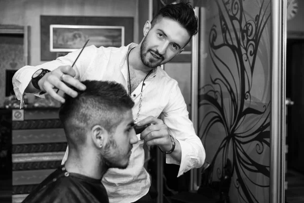 Hairdresser Cleaning Young Man After Haircut — Stock Photo, Image