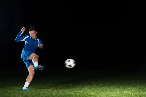Professional Soccer Player Kicking Ball Isolated On Black — Stock Photo, Image