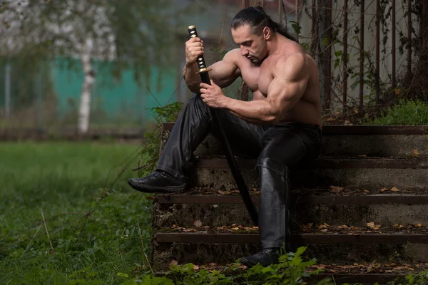 Fighter Holding Ancient Sword — Stock Photo, Image