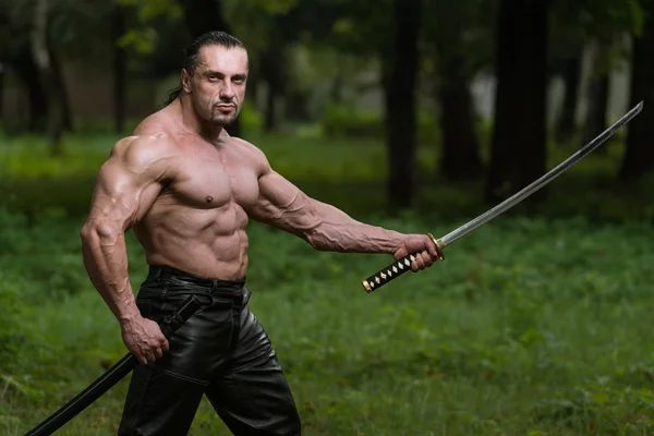 Mature Man In Action With Sword — Stock Photo, Image