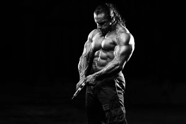 Muscular Man Holding Gun — Fotografie, imagine de stoc