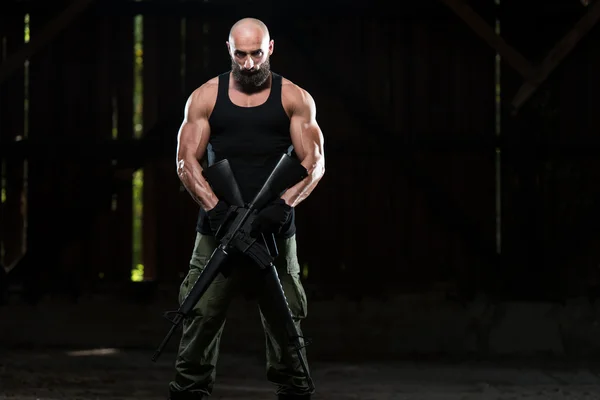 Beard Man With A Machine Gun — Stock Photo, Image