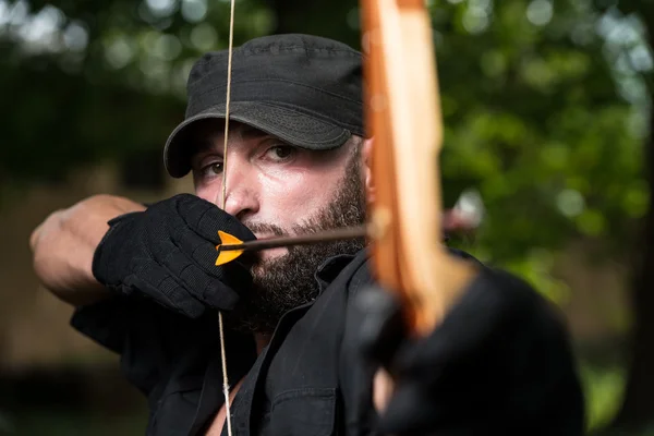 Archer Holds His Bow Aiming At A Target — Stock Photo, Image