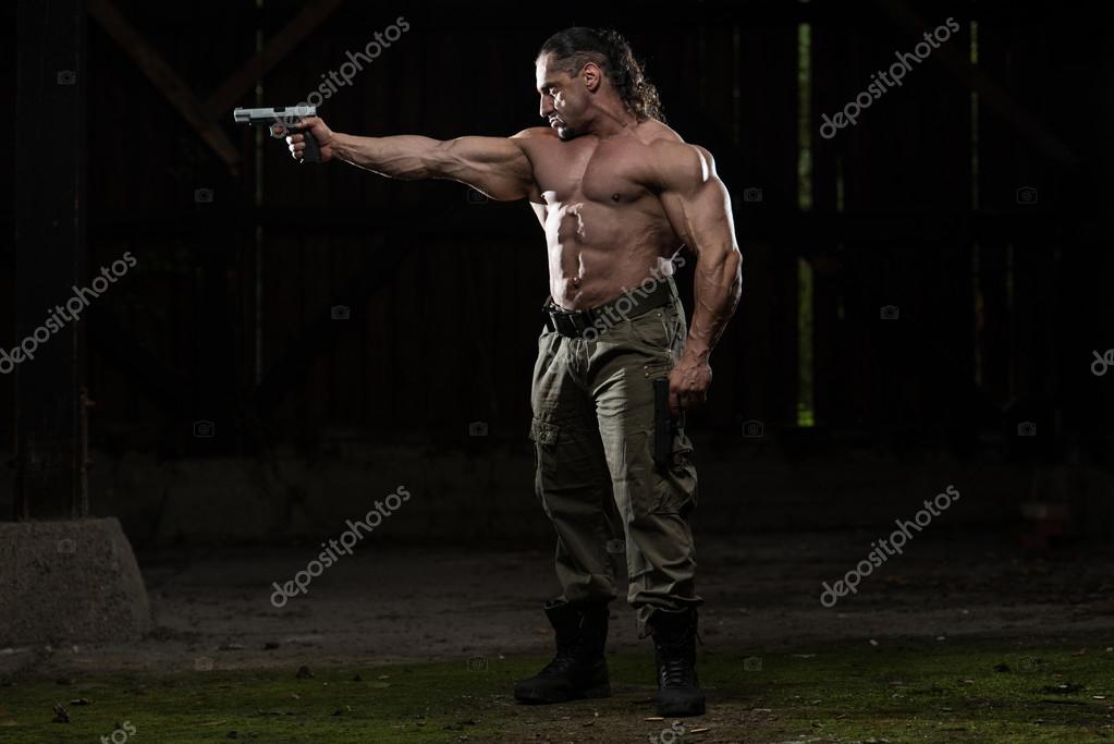 Soldier Drawing A Gun In Self Defense — Stock Photo © ibrak 56843543