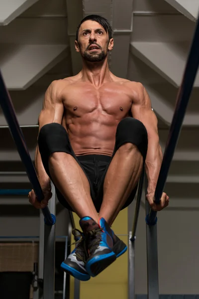 Fit Athlete Doing Exercise On Parallel Bars — Stock Photo, Image