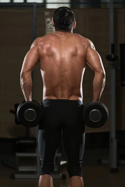 Male Athlete Doing Heavy Weight Exercise For Trapezius — Stock Photo, Image