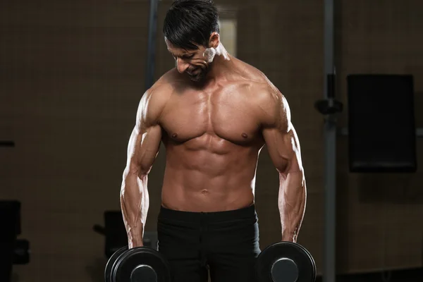 Male Athlete Doing Heavy Weight Exercise For Trapezius — Stock Photo, Image