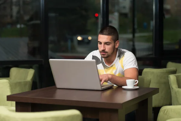 Happy Male Student In Cafe With Laptop — Stock Photo, Image