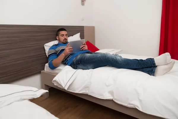 Happy Student On Bed Using Touch Pad — Stock Photo, Image
