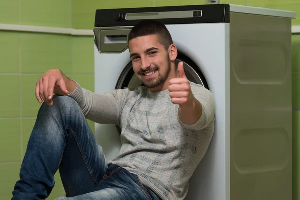 Young Man Doing Housework Laundry Thumbs Up Sign — Stock Photo, Image